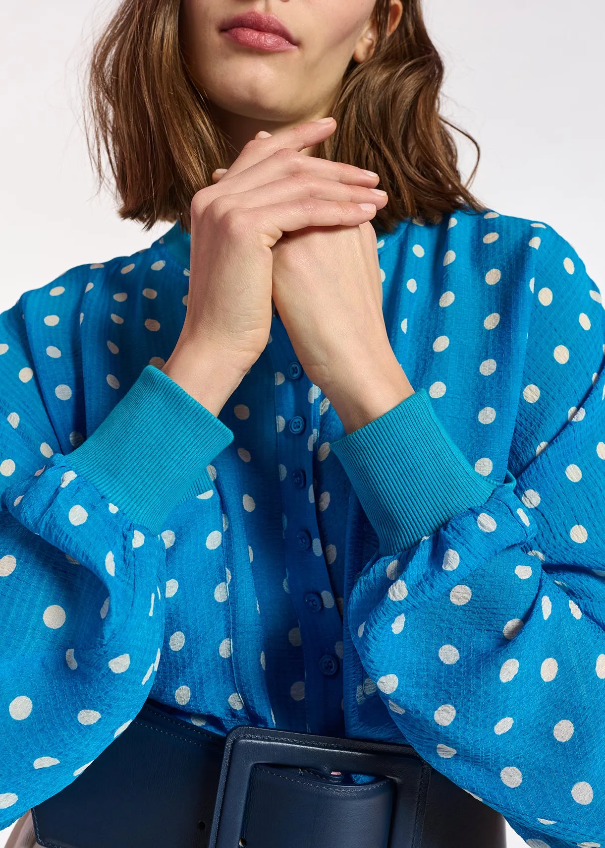 Blue and white polka-dot loose-fit top