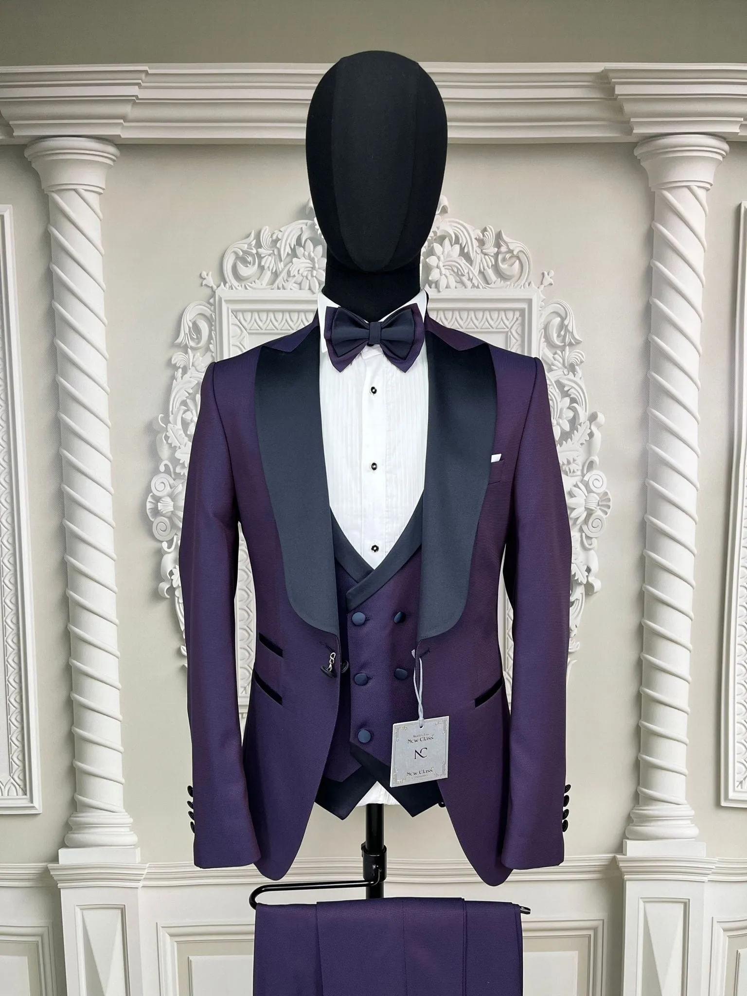 Single button three piece men's Suit with contrasting black velvet lapel, matching bow tie and Black Pants
