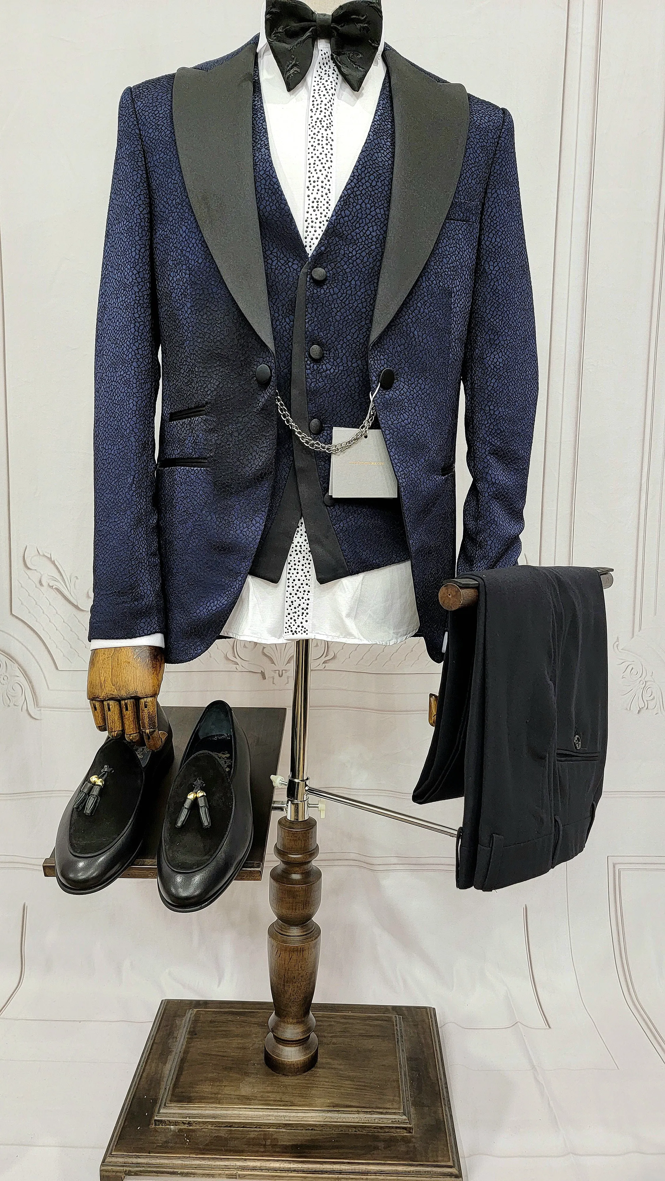 Three Piece Tuxedo Suit with Black Lapel, Matching Bow Tie and Pants.