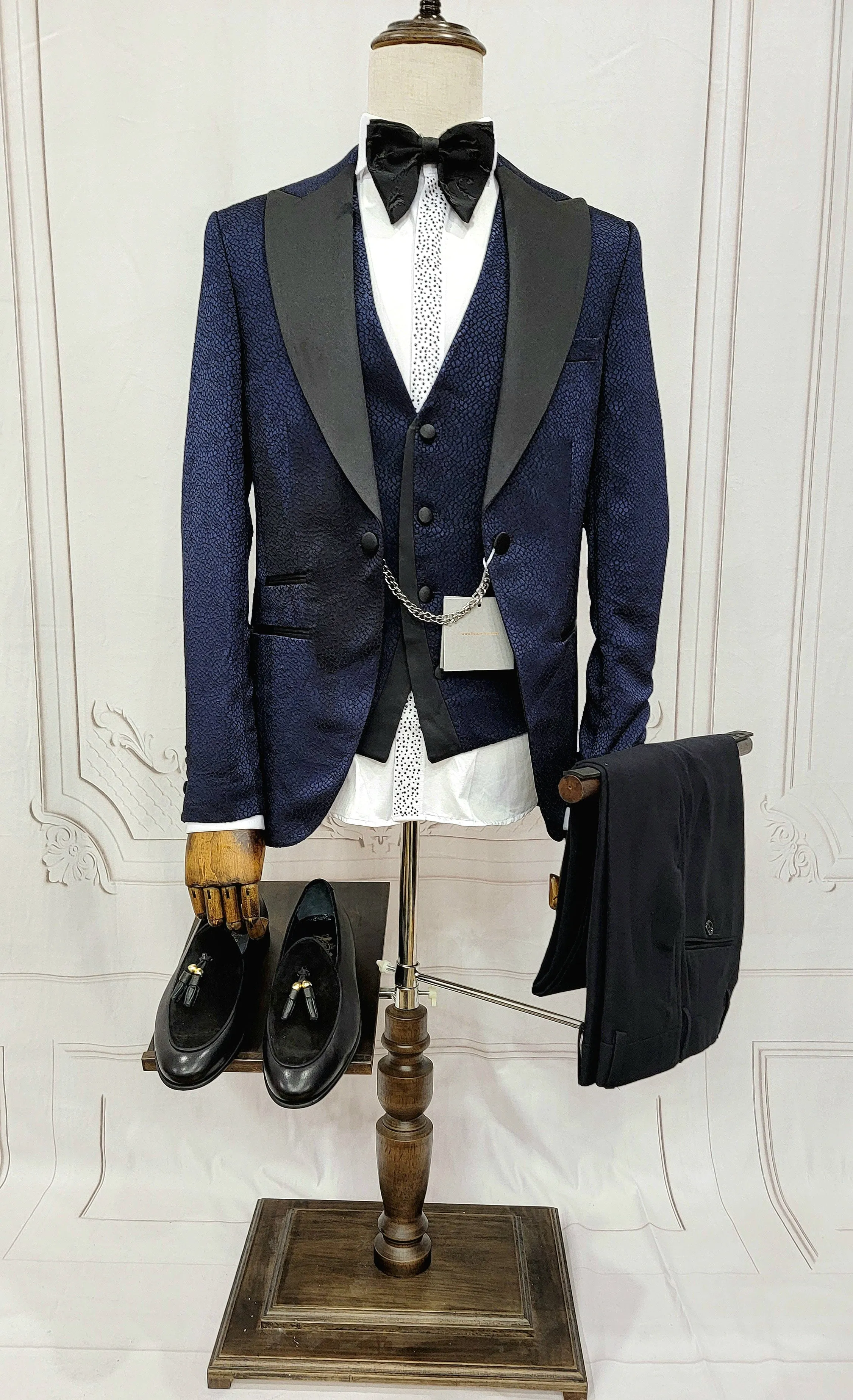 Three Piece Tuxedo Suit with Black Lapel, Matching Bow Tie and Pants.
