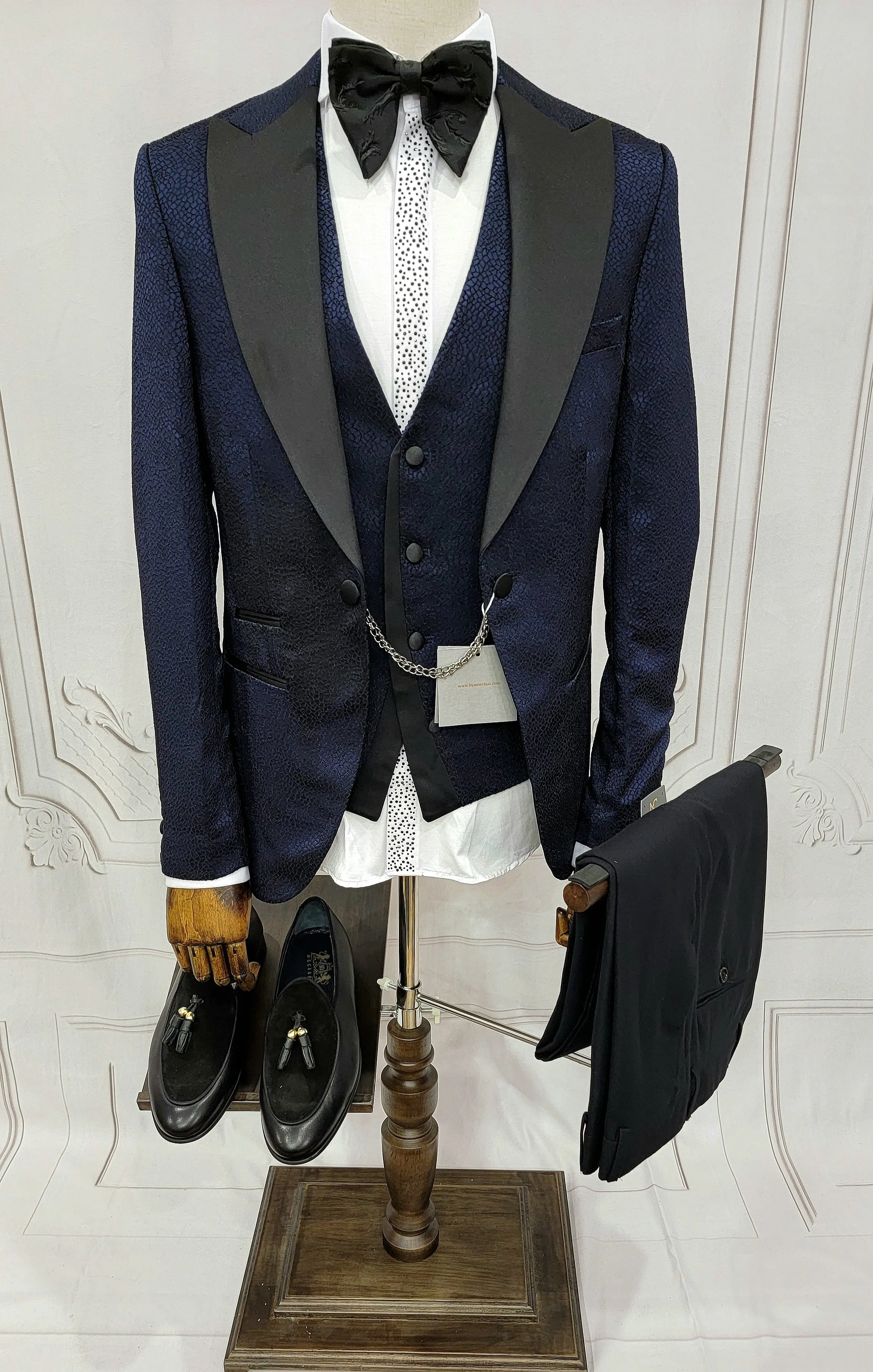 Three Piece Tuxedo Suit with Black Lapel, Matching Bow Tie and Pants.
