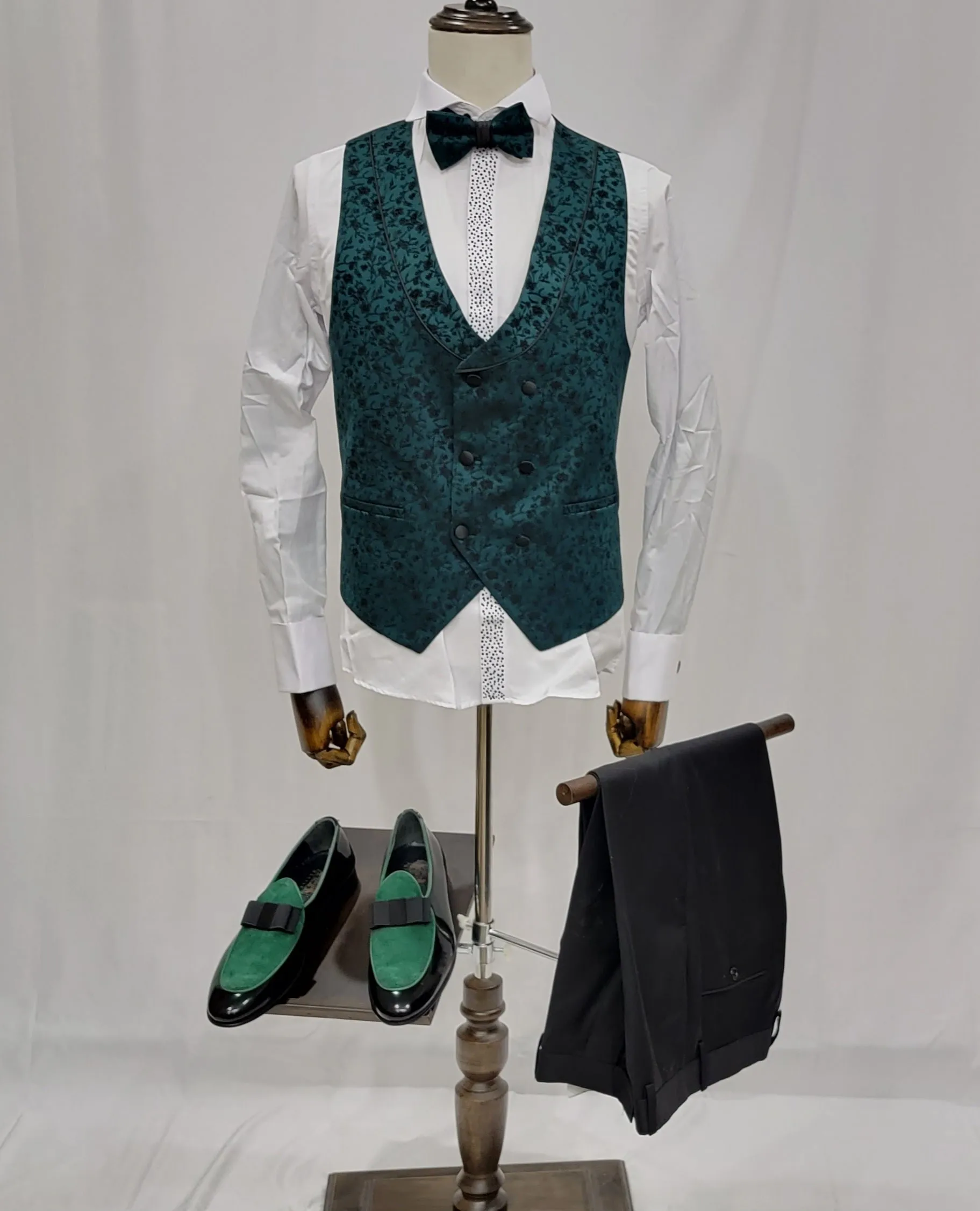 Three-Piece Tuxedo Suit with Contrasting green tapered accent, matching bow tie and Black Pants.