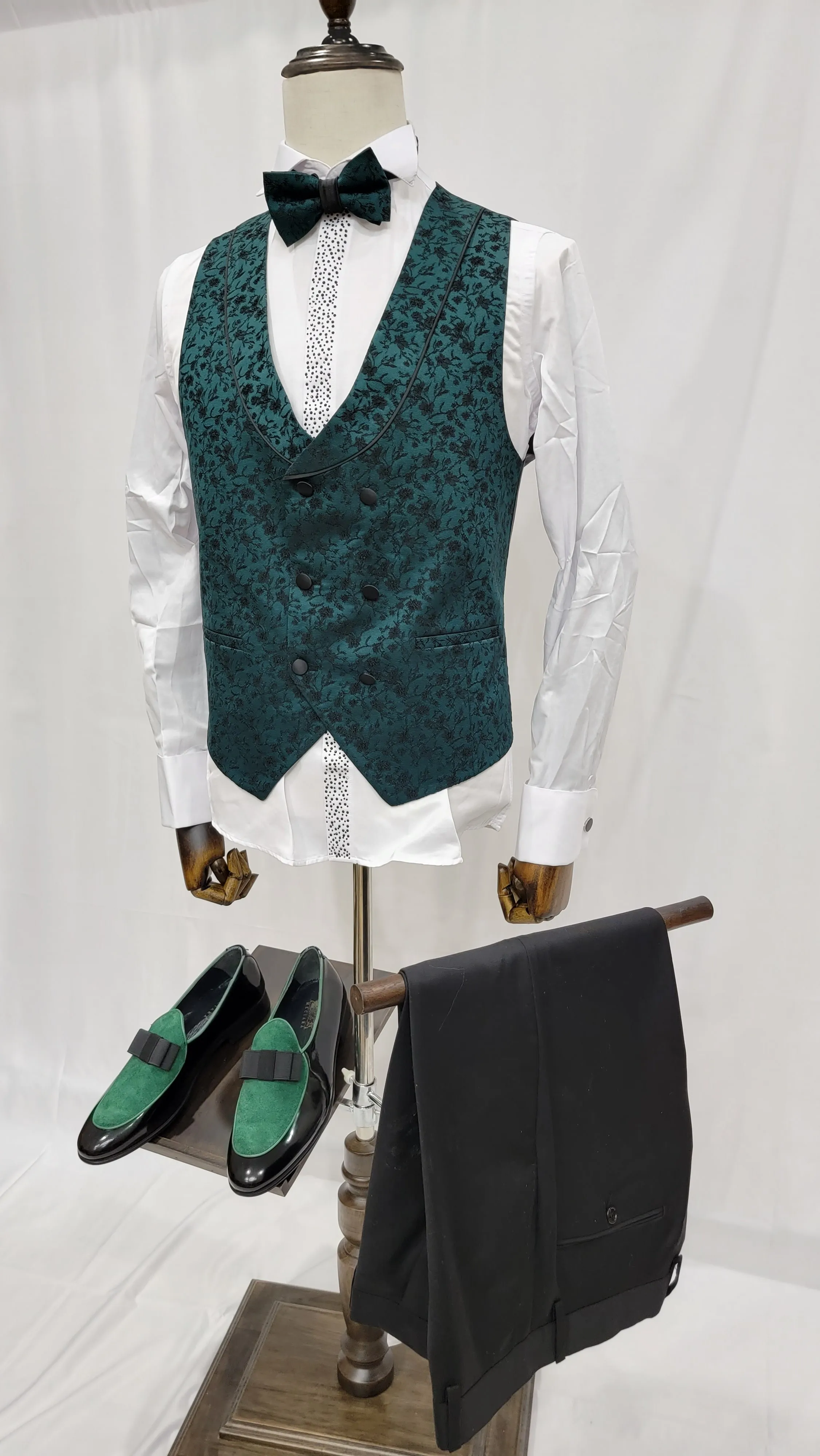 Three-Piece Tuxedo Suit with Contrasting green tapered accent, matching bow tie and Black Pants.