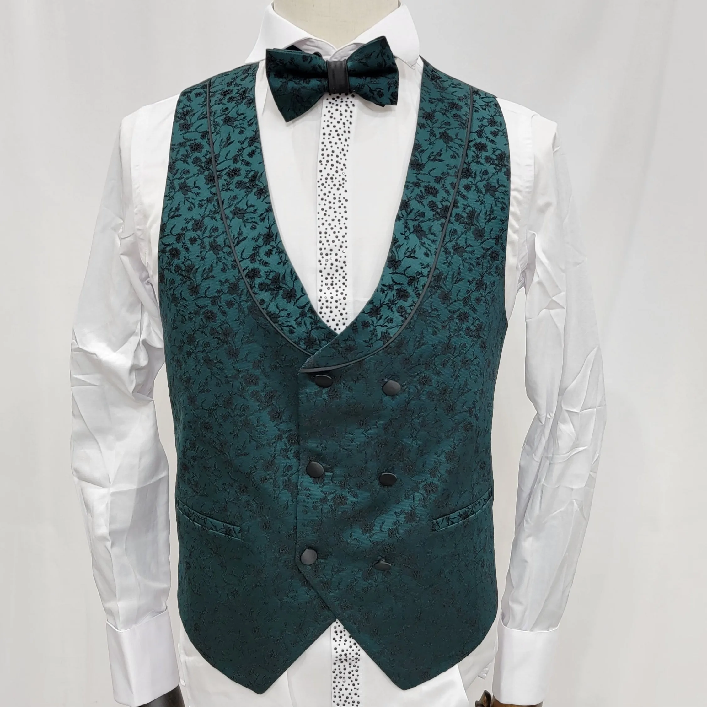 Three-Piece Tuxedo Suit with Contrasting green tapered accent, matching bow tie and Black Pants.