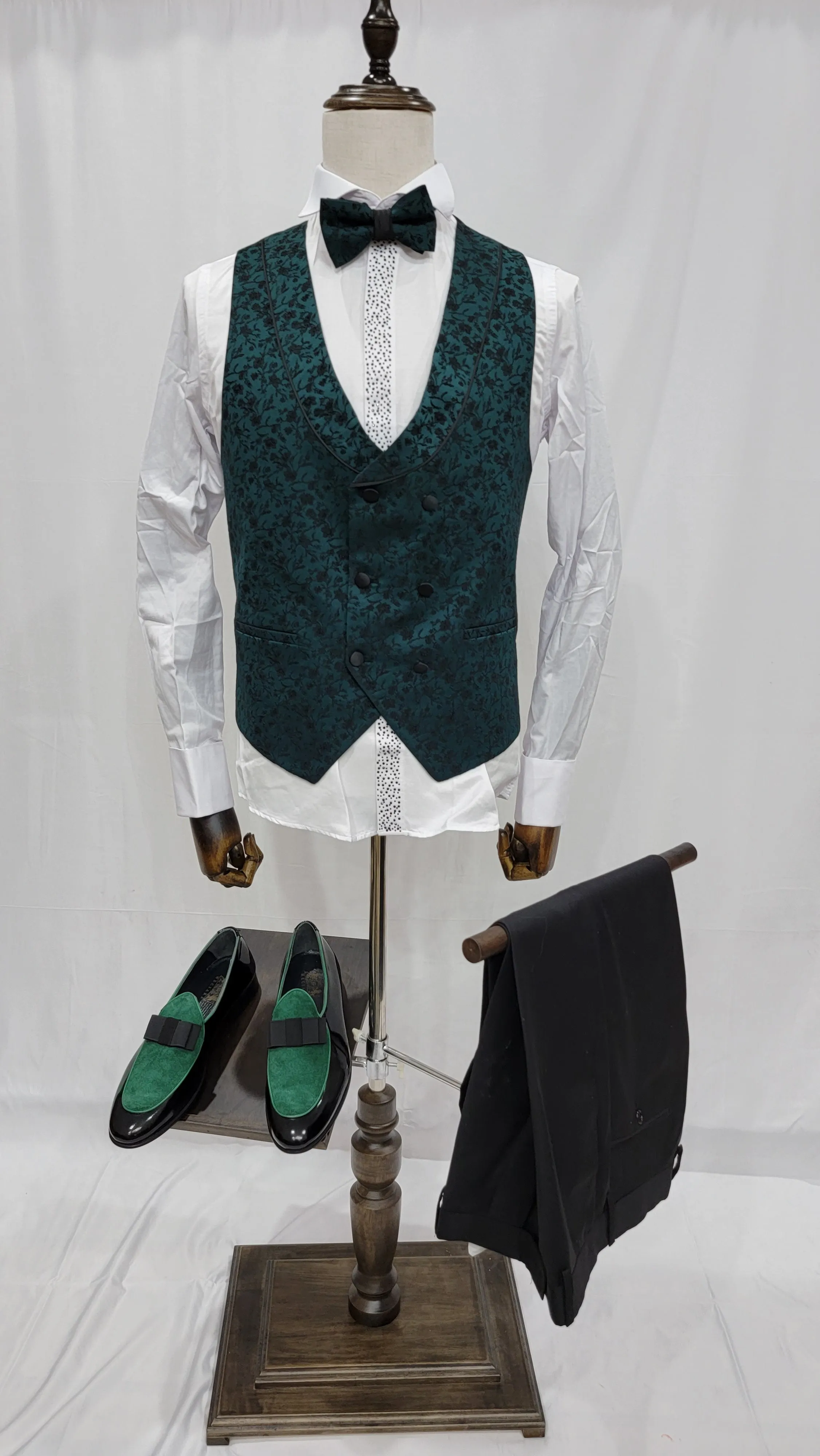 Three-Piece Tuxedo Suit with Contrasting green tapered accent, matching bow tie and Black Pants.