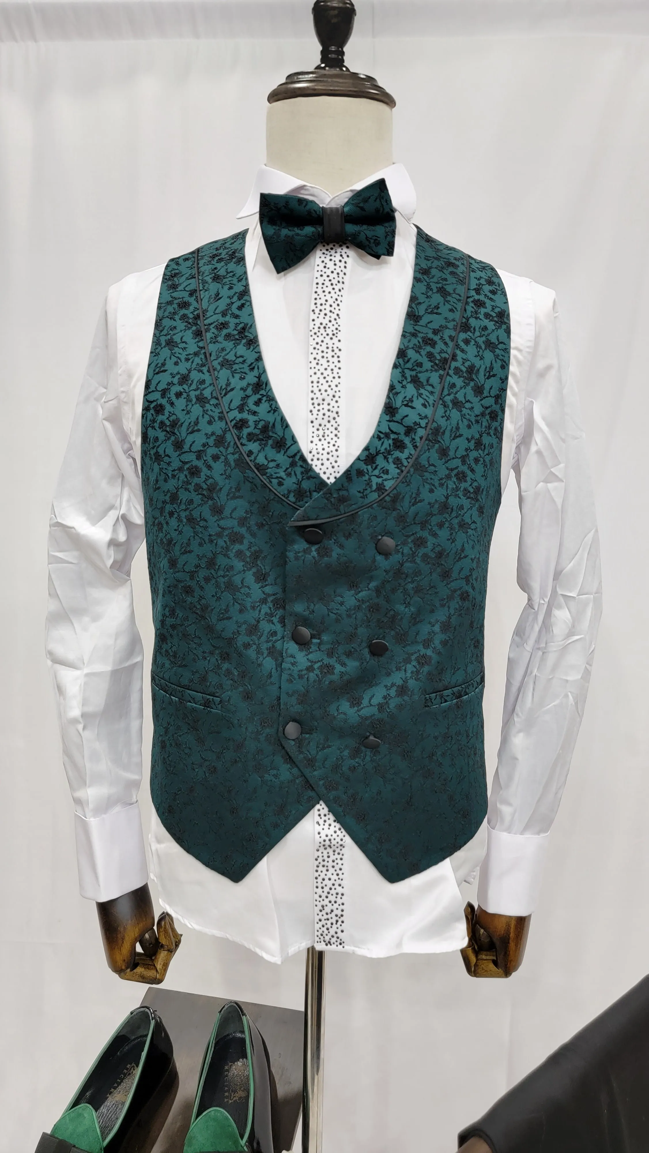Three-Piece Tuxedo Suit with Contrasting green tapered accent, matching bow tie and Black Pants.