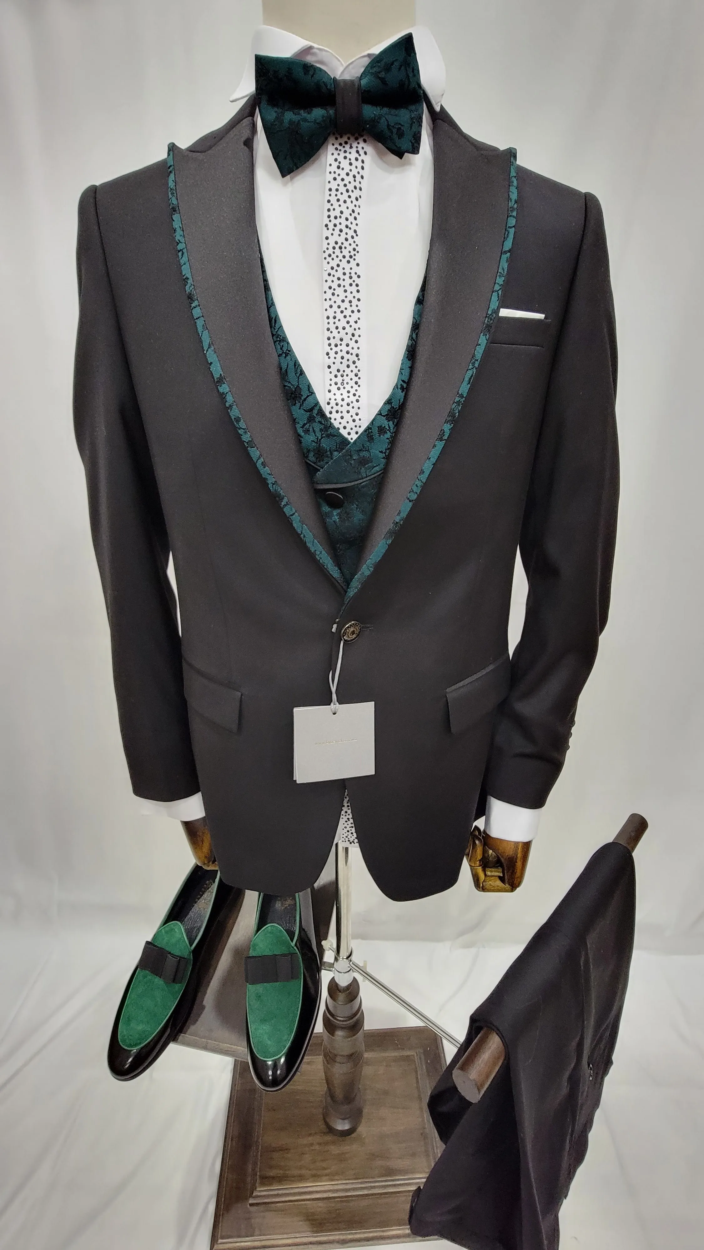 Three-Piece Tuxedo Suit with Contrasting green tapered accent, matching bow tie and Black Pants.