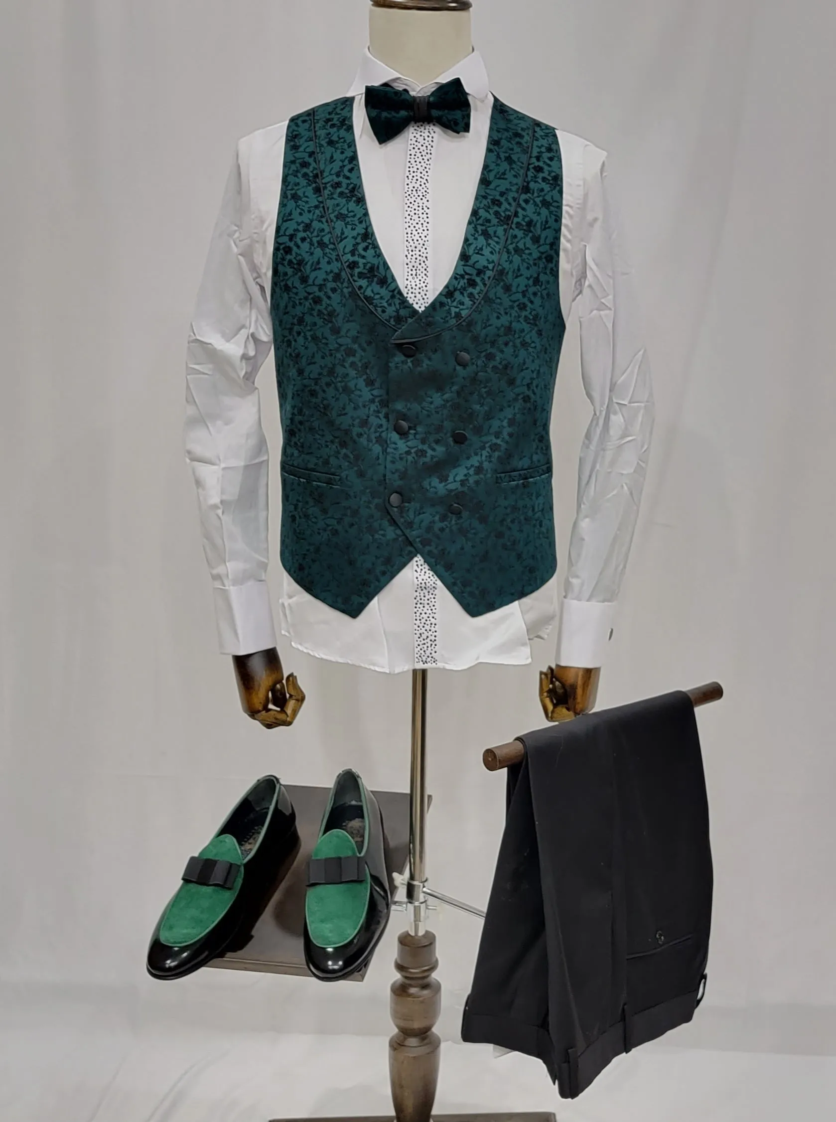 Three-Piece Tuxedo Suit with Contrasting green tapered accent, matching bow tie and Black Pants.