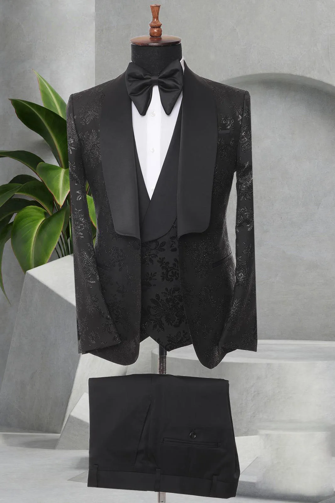 Three Pieces Tuxedo Suit with a Satin Lapel, matching bow tie and Black Pants.