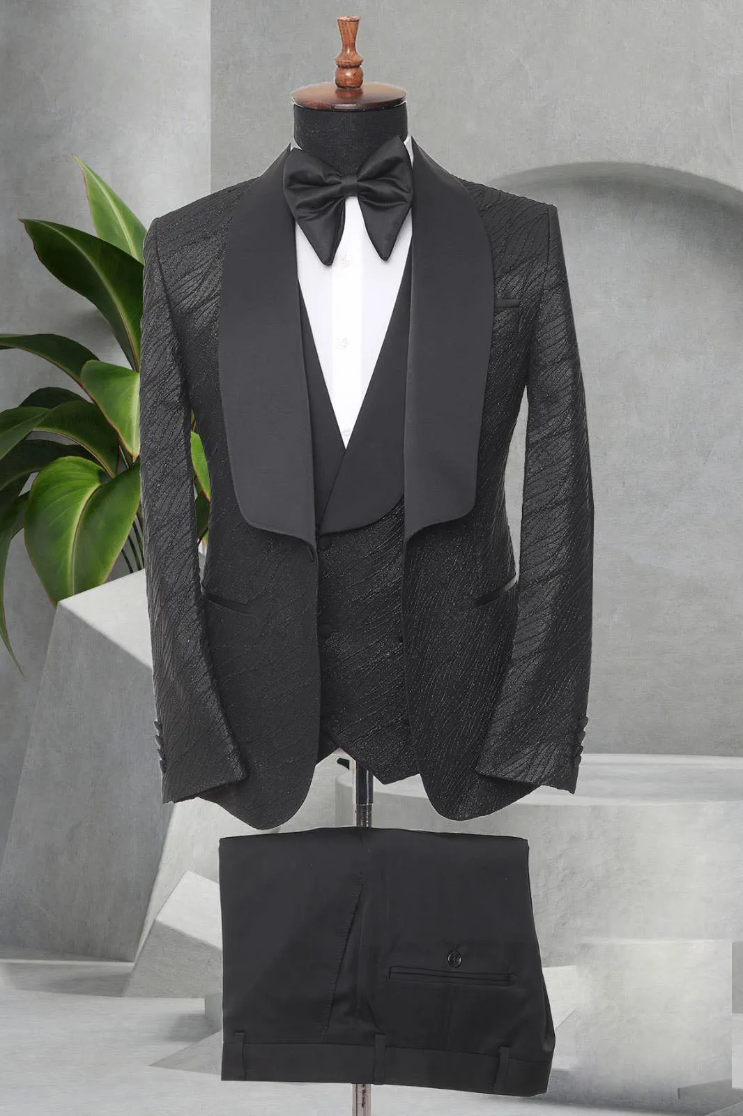 Three Pieces Tuxedo Suit with a Satin Lapel, matching bow tie and Black Pants.