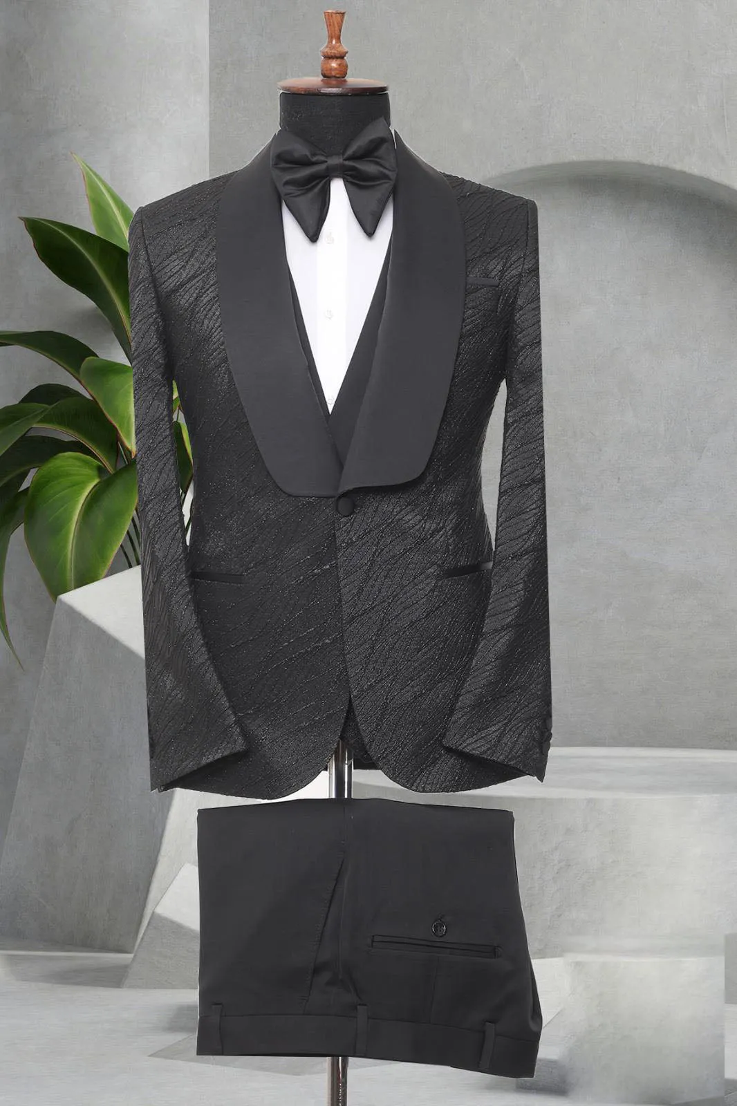 Three Pieces Tuxedo Suit with a Satin Lapel, matching bow tie and Black Pants.